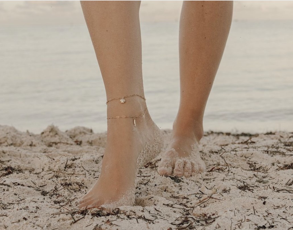 Permanent gold anklet on ankle