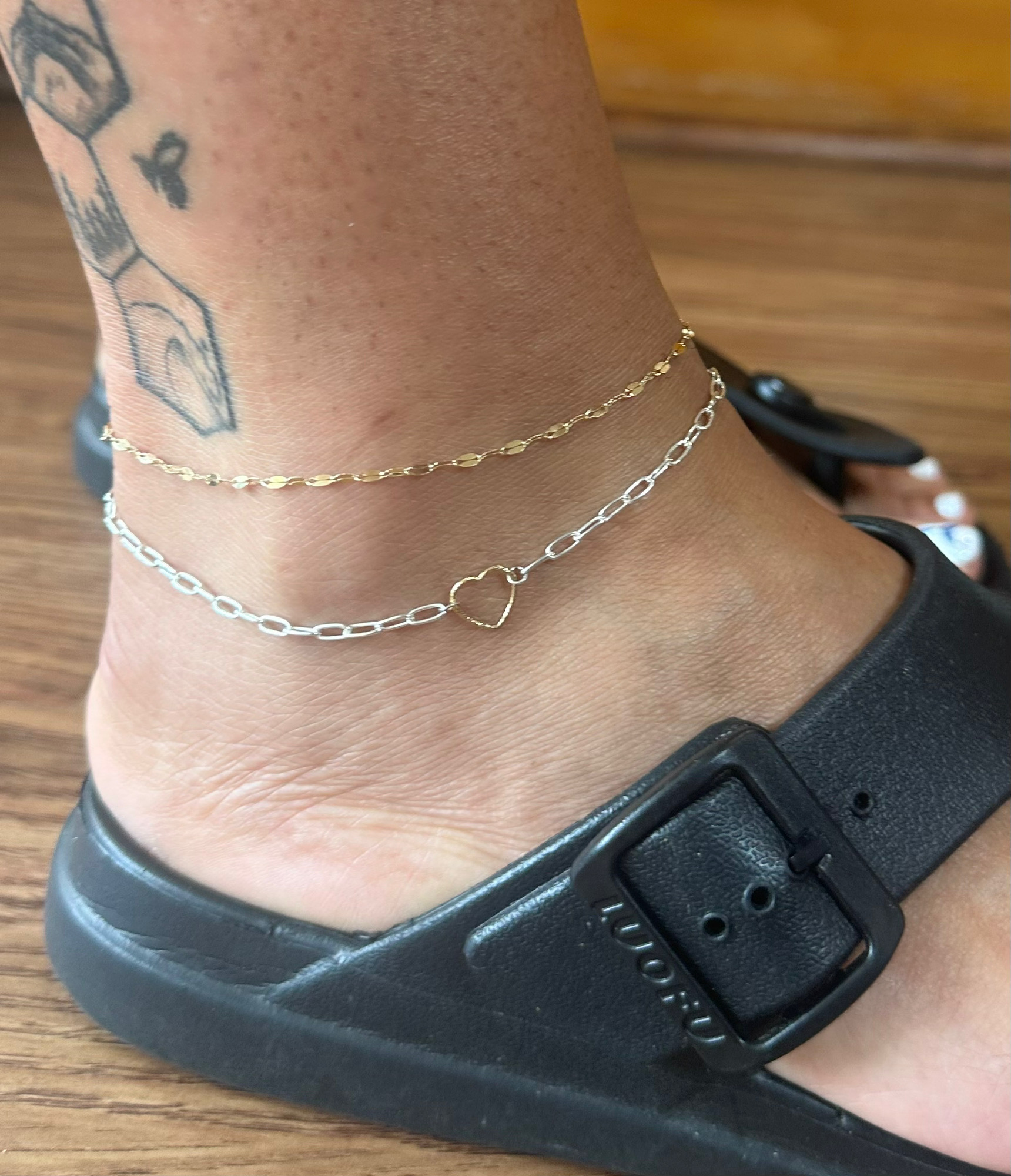 Gold permanent anklet close-up