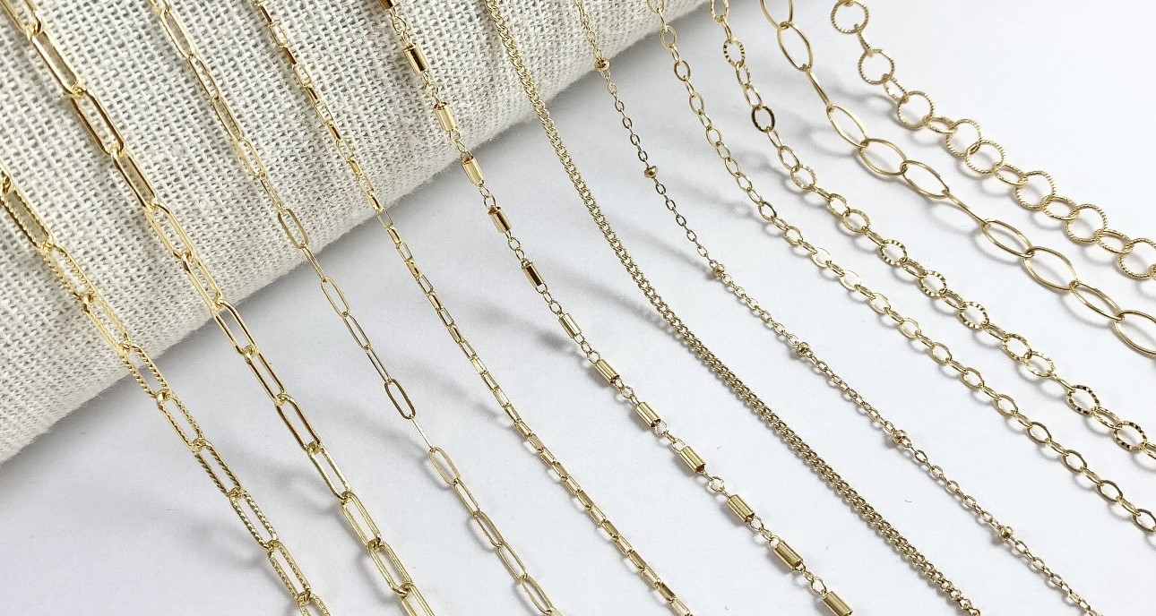 14k gold filled permanent bracelets stacked on wrist